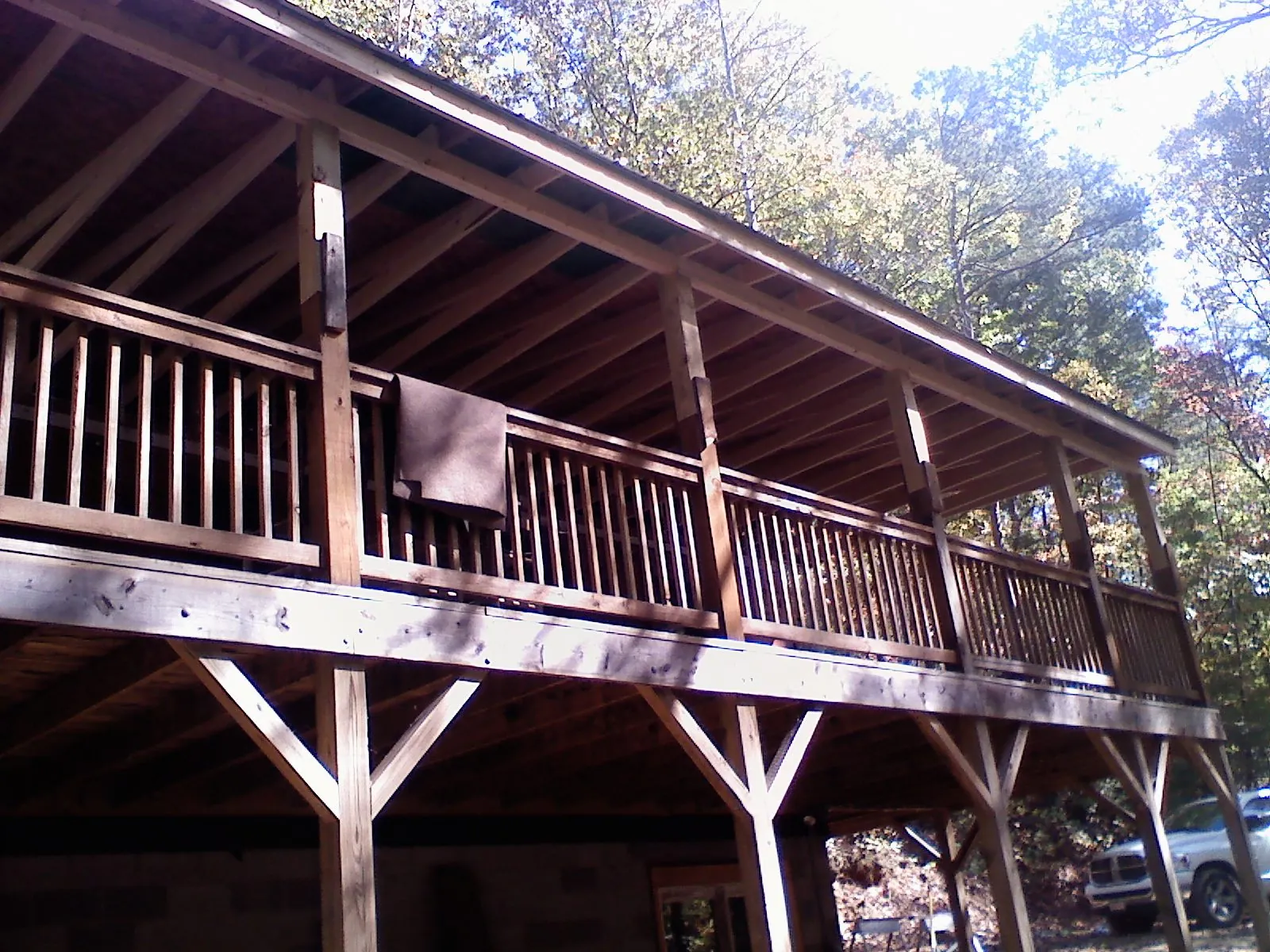 Timber framing under a new elevated porch and deck — Roof Leak Repair in Springwater by Roofing Brothers